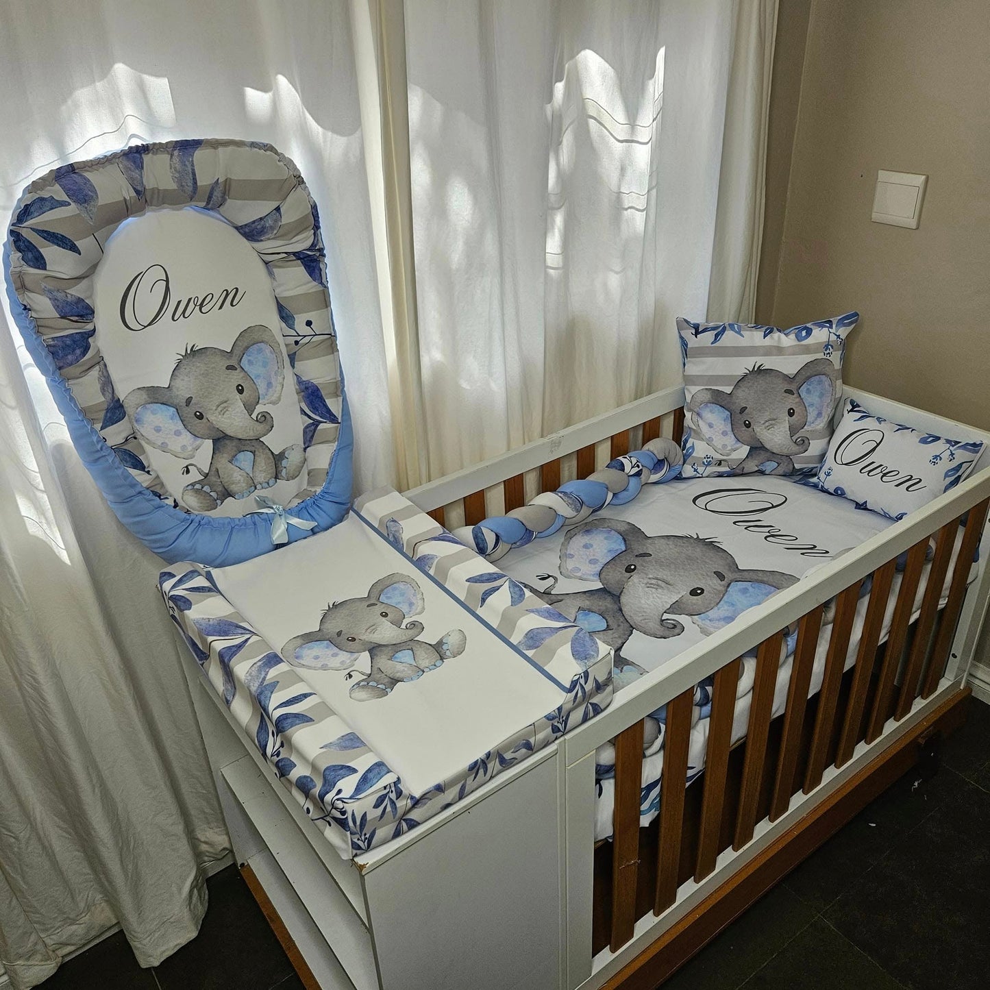 Owen the cute Baby Blue Ellie cot linen +