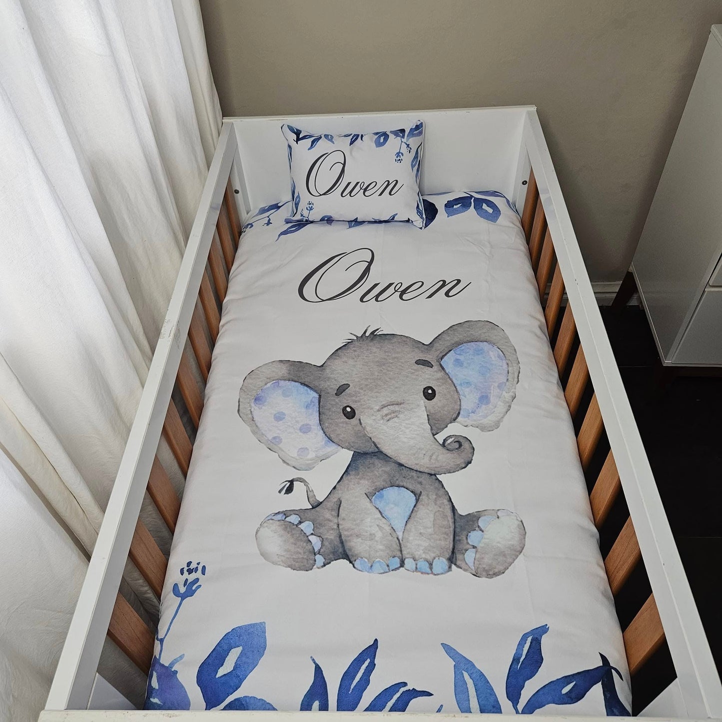 Owen the cute Baby Blue Ellie cot linen +
