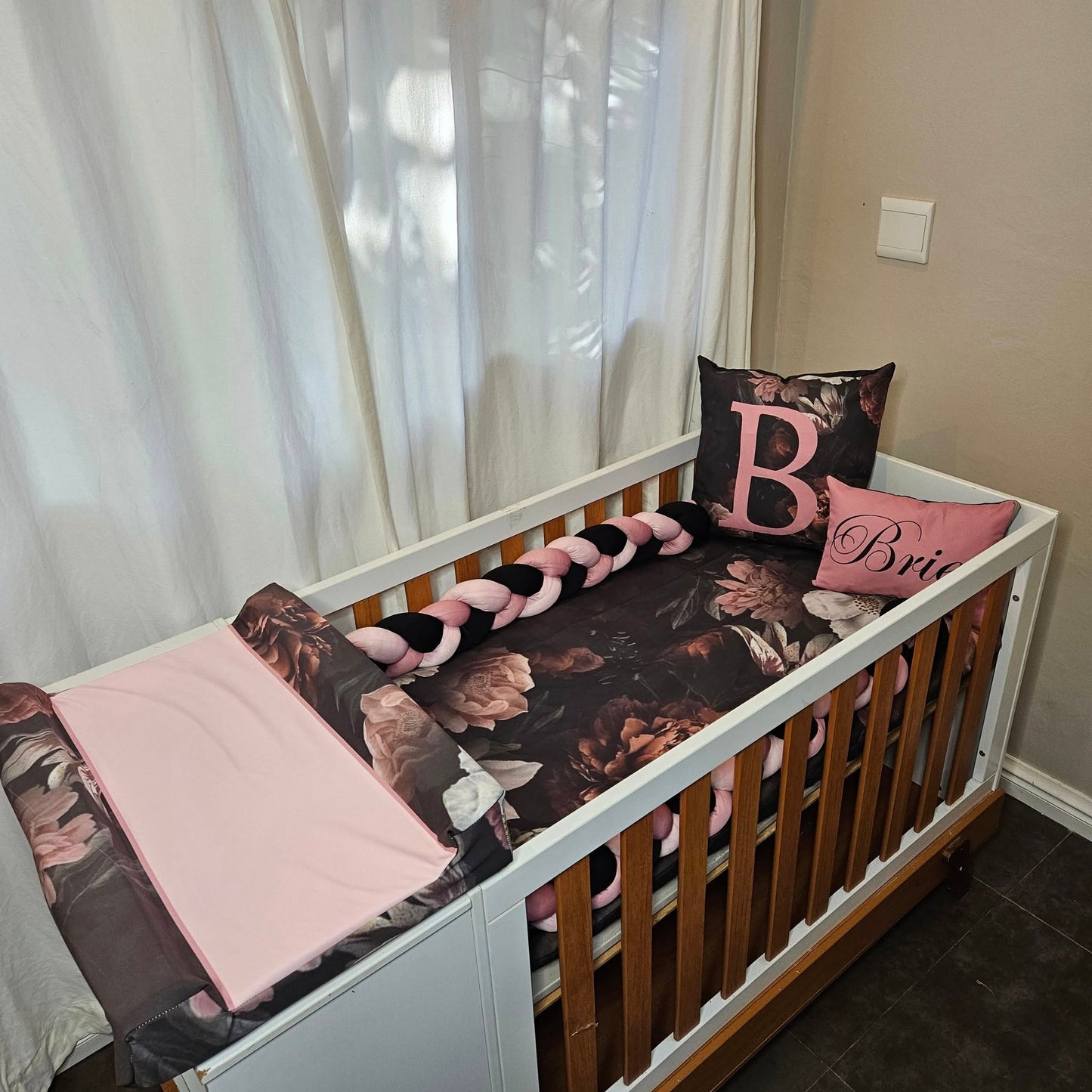 Sophisticated black and pink Floral cot linen