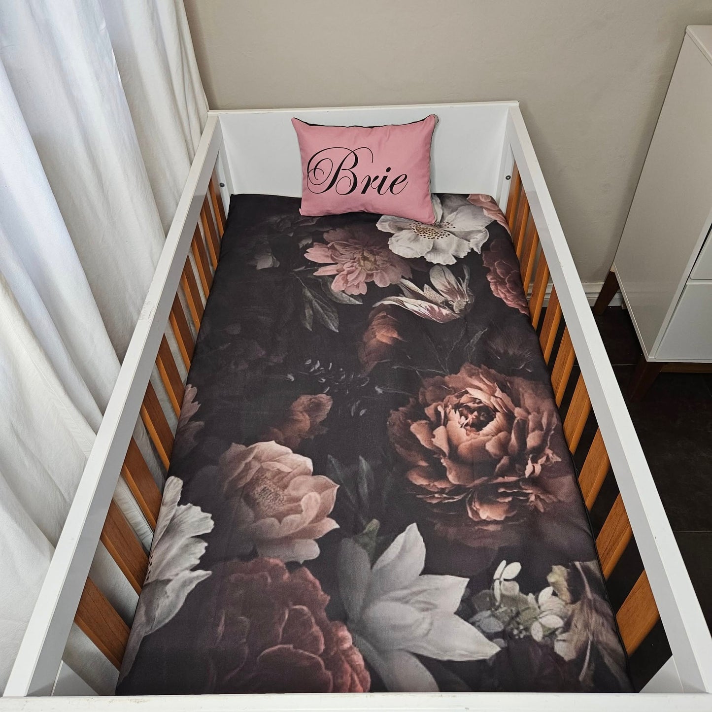 Sophisticated black and pink Floral cot linen