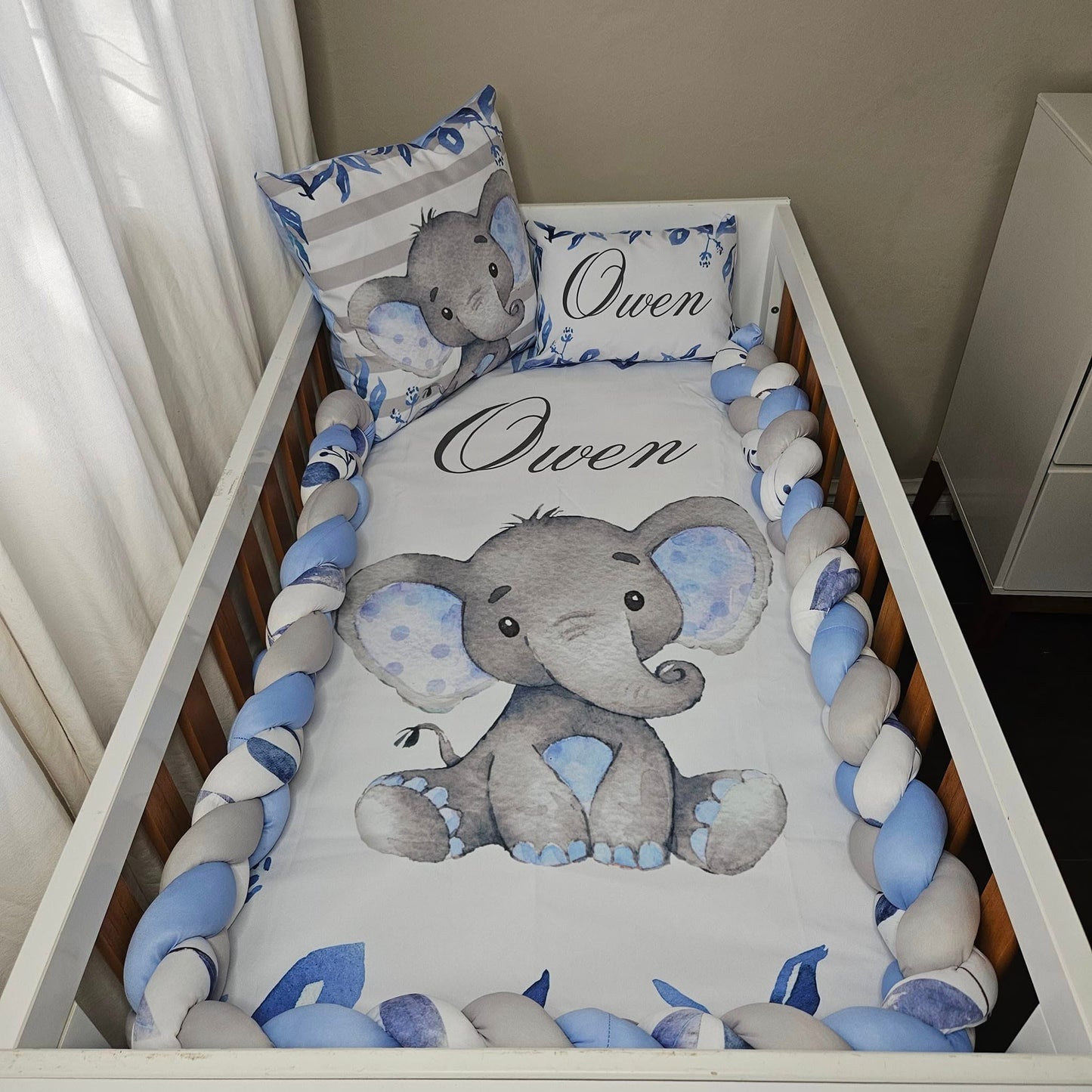 Owen the cute Baby Blue Ellie cot linen