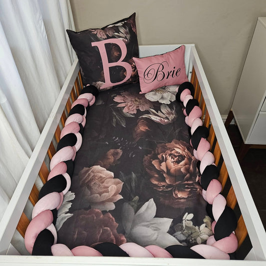 Sophisticated black and pink Floral cot linen