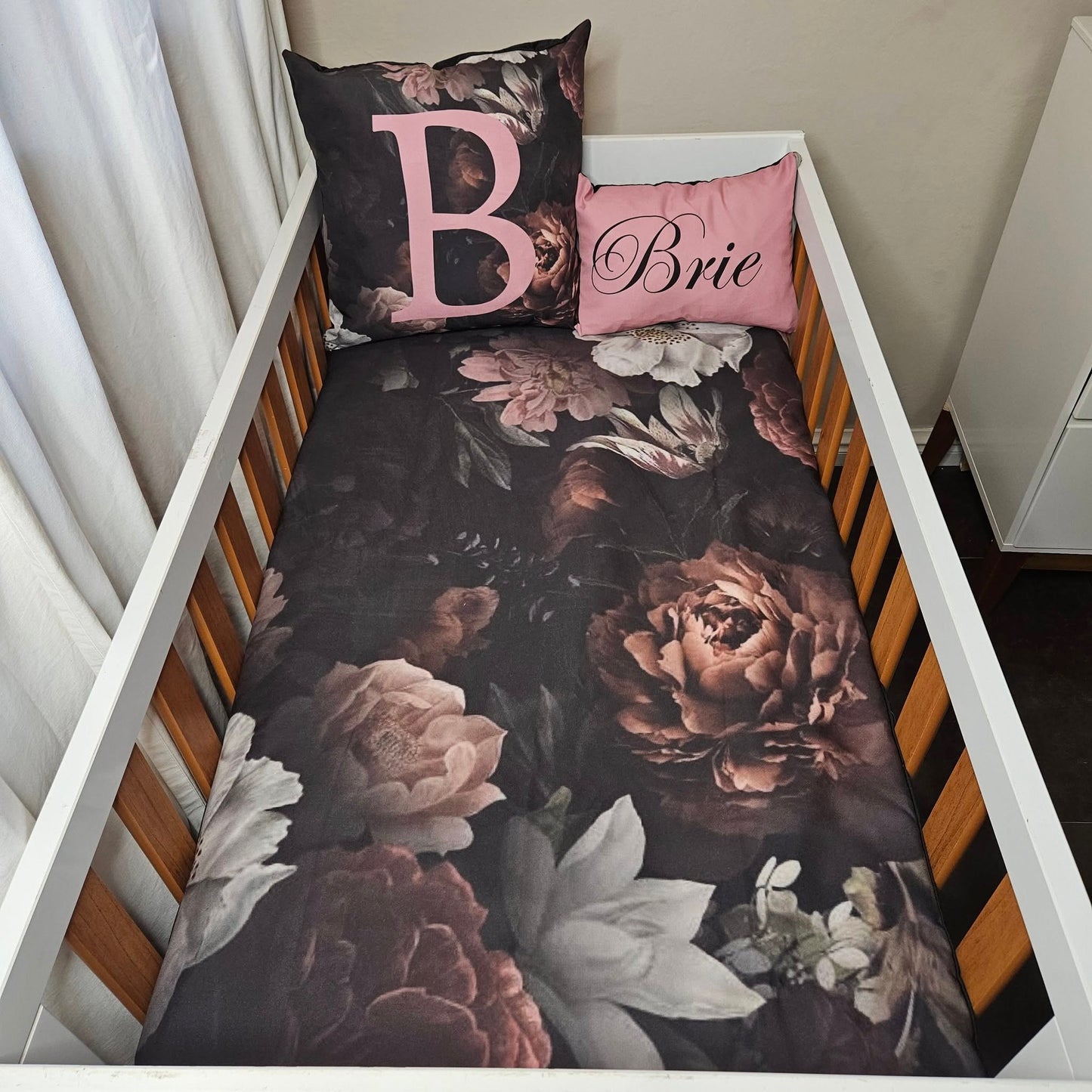 Sophisticated black and pink Floral cot linen