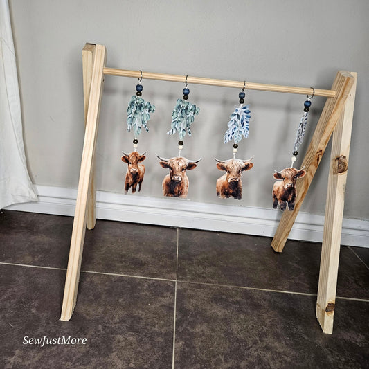 The Baby Highland cow play gym